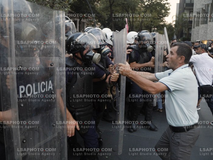 PROTESTERS FACE POLICE OFFICERS IN FRONT OF PARLIAMENT